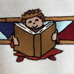 Anachronistic Achashverosh reading his journal-book. Codices are just cuter than scrolls.