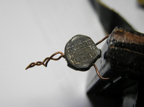 Tefillin with little tags wired onto them